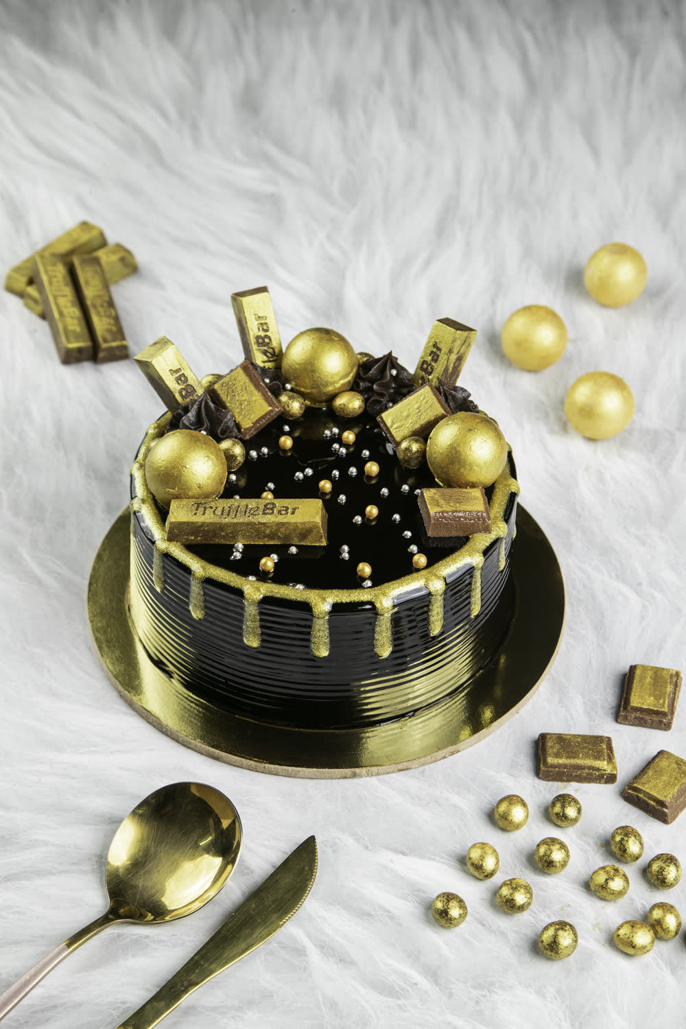 Chocolate celebration cake with gold detailing