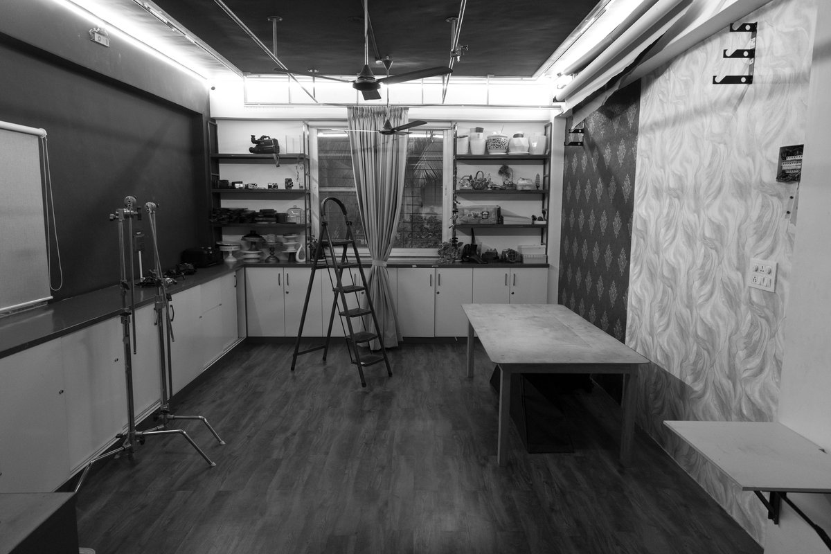 Studio floor at the Pune flagship with stands, backdrops and prop shelves
