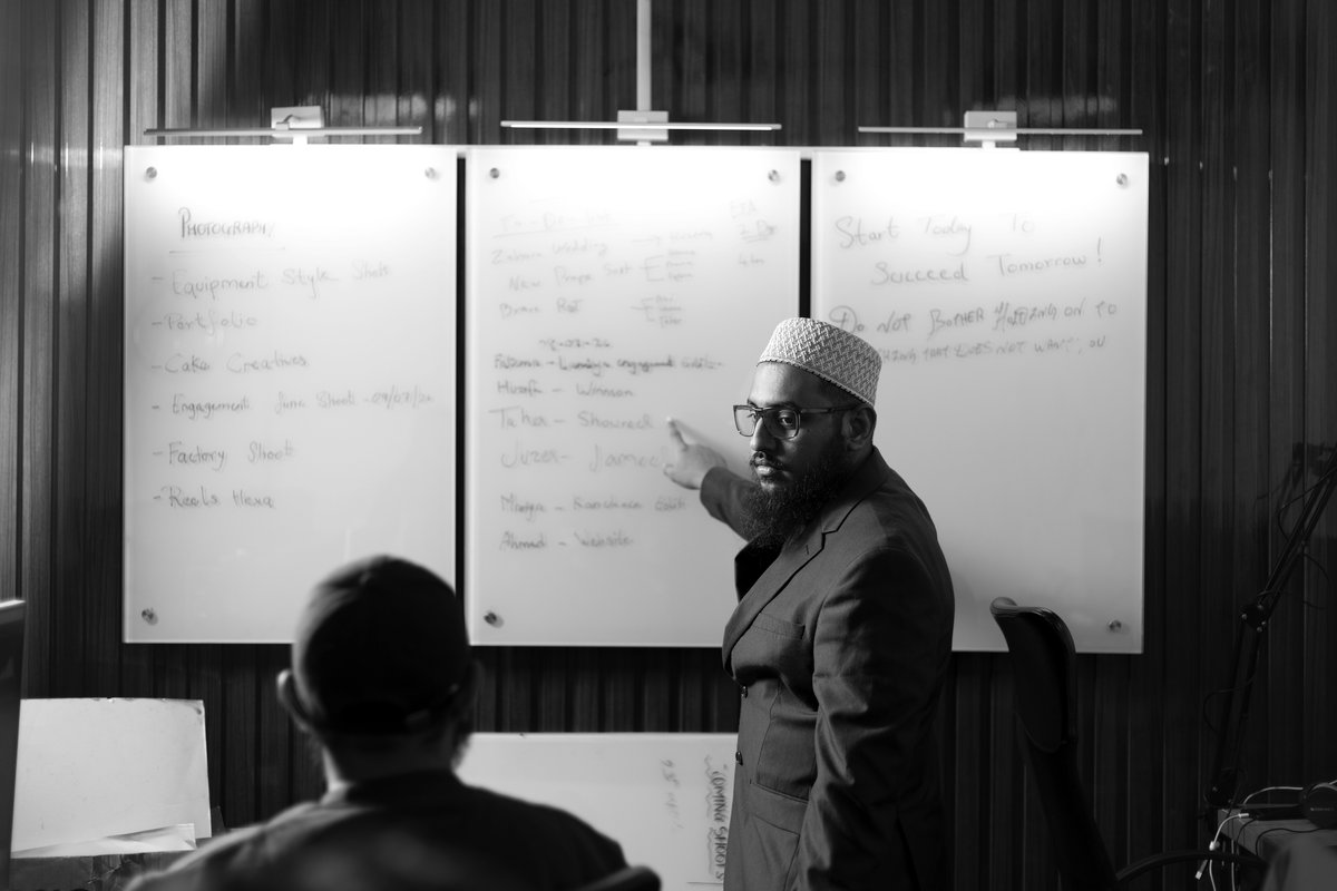 Production meeting at the glass whiteboards in the Pune studio